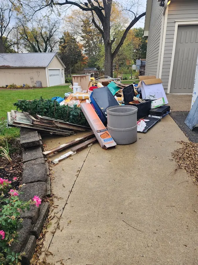 Dumpster being loaded with debris for 3 Yard Dumpster Rental in Houma